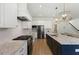 Spacious kitchen with granite countertops, stainless appliances, and pendant lighting at 1724 Deacon Falls Way, Wendell, NC 27591