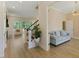 Open-concept living room with hardwood floors, a fireplace, and plenty of natural light at 1724 Deacon Falls Way, Wendell, NC 27591