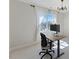 Bright office space with large window, modern desk, and comfortable office chair at 1724 Deacon Falls Way, Wendell, NC 27591