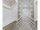 Long walk-in closet with custom shelving and ample storage space at 1724 Deacon Falls Way, Wendell, NC 27591