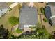 Bird's-eye view of the home's backyard, featuring a patio, landscaping, and mature trees providing privacy at 2008 Stanwood Dr, Apex, NC 27502