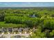 Community view reveals a pond, trees, and homes with lawns; it is a peaceful place to live close to nature at 2008 Stanwood Dr, Apex, NC 27502