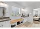 Bright bathroom features double sinks, modern fixtures, natural light, and vanity storage at 2008 Stanwood Dr, Apex, NC 27502