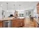 Open kitchen featuring a large kitchen island with a sink and hardwood floors at 2008 Stanwood Dr, Apex, NC 27502