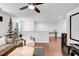 Bright living room boasts hardwood floors, contemporary decor, and an open layout, perfect for entertaining guests at 2008 Stanwood Dr, Apex, NC 27502