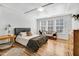 Spacious main bedroom with tray ceilings, hardwood floors, and large windows at 2008 Stanwood Dr, Apex, NC 27502