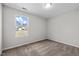 Cozy bedroom with a window offering outside views and neutral carpet at 2040 Alderman Way, Creedmoor, NC 27522
