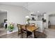 Charming dining area featuring a wooden table, chair set, and modern pendant lighting at 2040 Alderman Way, Creedmoor, NC 27522