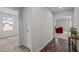 Inviting hallway connecting to a living area, bedroom and hardwood floors at 2040 Alderman Way, Creedmoor, NC 27522