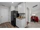 Efficient kitchen featuring black appliances, granite counters, white cabinets, and hard surface flooring at 2040 Alderman Way, Creedmoor, NC 27522