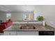 Bright kitchen with granite countertops, and stainless steel appliances seamlessly connecting to the living space at 2040 Alderman Way, Creedmoor, NC 27522