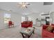 Bright living room with vaulted ceilings and comfortable red sofas, great for relaxing at 2040 Alderman Way, Creedmoor, NC 27522