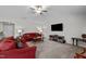 Inviting living room with plush sofas, a ceiling fan and modern entertainment setup at 2040 Alderman Way, Creedmoor, NC 27522
