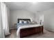 Spacious main bedroom featuring a large bed, neutral carpet, and ensuite bathroom at 2040 Alderman Way, Creedmoor, NC 27522
