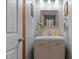A modern bathroom featuring a stylish vanity, mirror, and chic decor for a relaxing ambiance at 209 Pen Lou Ct, Angier, NC 27501