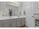 Bathroom featuring double sinks, ample counter space, and well-lit vanity, for added convenience at 209 Pen Lou Ct, Angier, NC 27501