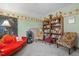 Cozy bedroom featuring an eclectic mix of furniture, bookshelves, and a relaxing seating area at 209 Pen Lou Ct, Angier, NC 27501