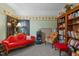 Relaxing bedroom featuring cozy seating, a bookshelf, and eclectic decor, creating a peaceful ambiance at 209 Pen Lou Ct, Angier, NC 27501