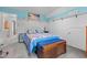 Comfortable bedroom with a queen-size bed and beach-themed decor at 209 Pen Lou Ct, Angier, NC 27501