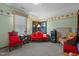 Eclectic bedroom with red furniture, unique decor, and charming details, offering a cozy retreat at 209 Pen Lou Ct, Angier, NC 27501