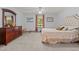 Spacious bedroom featuring a tufted headboard bed, complemented by a dresser and ample natural light at 209 Pen Lou Ct, Angier, NC 27501