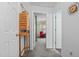 Hallway with neutral carpet, white walls, and open doorways at 209 Pen Lou Ct, Angier, NC 27501