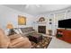 Comfortable living room with a cozy couch, fireplace, and media center for relaxing and entertaining at 209 Pen Lou Ct, Angier, NC 27501