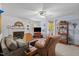 Cozy living room featuring a fireplace, media center, and comfortable seating for relaxing and entertaining at 209 Pen Lou Ct, Angier, NC 27501