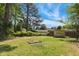 Grassy backyard featuring a shed and a wood fence for privacy at 2211 Hillock Dr, Raleigh, NC 27612