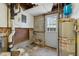Basement area with a water heater and access to the exterior at 2211 Hillock Dr, Raleigh, NC 27612