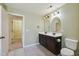 Bathroom with a dual vanity sink and walk-in closet adjacent at 2211 Hillock Dr, Raleigh, NC 27612