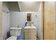 Small bathroom featuring a vanity with a sink and toilet next to the shower at 2211 Hillock Dr, Raleigh, NC 27612