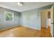 Bedroom featuring hardwood floors and an adjacent doorway at 2211 Hillock Dr, Raleigh, NC 27612