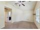 Large bedroom featuring neutral colors and view into the bathroom at 2211 Hillock Dr, Raleigh, NC 27612