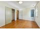 Spacious bedroom with hardwood floors and an adjacent bathroom at 2211 Hillock Dr, Raleigh, NC 27612