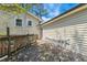 View of home from wooden deck with a ladder; features durable siding and well-maintained exterior at 2211 Hillock Dr, Raleigh, NC 27612