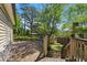 Spacious wooden deck perfect for outdoor gatherings, with views of the lush backyard and storage shed at 2211 Hillock Dr, Raleigh, NC 27612