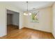 Dining room with hardwood flooring and a window with views of backyard at 2211 Hillock Dr, Raleigh, NC 27612