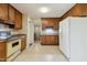 Traditional kitchen with wood cabinets, laminate countertops, and linoleum floors, offering ample storage at 2211 Hillock Dr, Raleigh, NC 27612