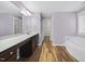 Primary bathroom featuring double vanity and soaking tub at 226 Fair Oaks Ct, Mebane, NC 27302