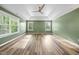 Spacious bedroom offers tray ceilings, three windows, and hardwood floors at 226 Fair Oaks Ct, Mebane, NC 27302