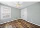 Bedroom featuring a ceiling fan, light-colored walls, and a double door closet at 226 Fair Oaks Ct, Mebane, NC 27302