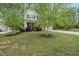 Charming two-story home with well-manicured lawn and mature trees at 226 Fair Oaks Ct, Mebane, NC 27302