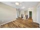 Upstairs hallway features hardwood floors, white trim, and bright lighting at 226 Fair Oaks Ct, Mebane, NC 27302