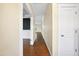 Bright hallway with hardwood floors and white trim leading into other rooms at 226 Fair Oaks Ct, Mebane, NC 27302