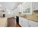 Kitchen featuring granite countertops, white cabinets, and stainless steel appliances at 226 Fair Oaks Ct, Mebane, NC 27302
