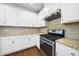 Kitchen featuring stainless steel appliances, granite countertops, and white cabinetry at 226 Fair Oaks Ct, Mebane, NC 27302