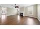 Bright living room with hardwood floors, fireplace, ceiling fan, and ample natural light at 226 Fair Oaks Ct, Mebane, NC 27302