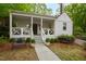 Inviting front porch with cozy seating and decorative plants, offering a relaxing outdoor space at 2415 Van Dyke Ave, Raleigh, NC 27607