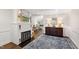 Elegant living room featuring a fireplace, hardwood floors, and sophisticated decor, perfect for entertaining at 2415 Van Dyke Ave, Raleigh, NC 27607